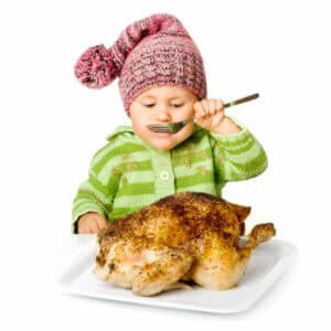 kid eating a turkey